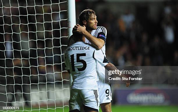 Swansea player Michu celebrates with goalscorer Wayne Routledge after the first Swansea goal during the UEFA Europa League match between Swansea City...