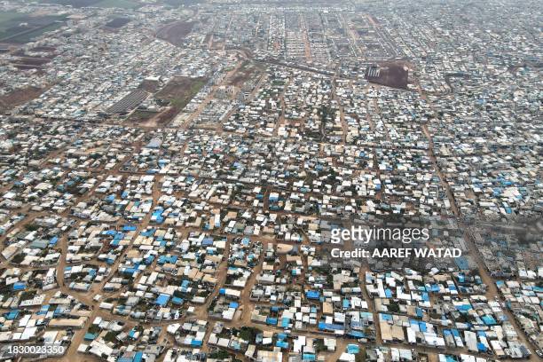 An aerial picture shows the camp of Atme for displaced Syrians, on the outskirts of Idlib, in rebel-held northwestern Syria, on December 6, 2023....