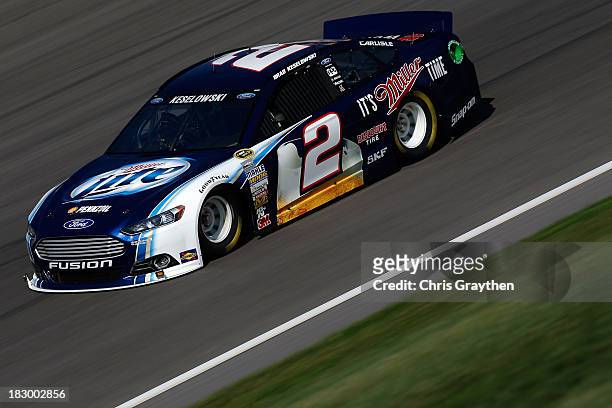 Brad Keselowski, driver of the Miller Lite Ford, drives during testing for the NASCAR Sprint Cup Series at Kansas Speedway on October 3, 2013 in...