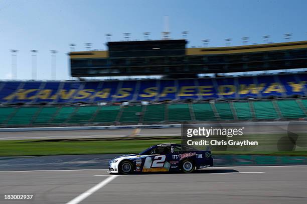 Brad Keselowski, driver of the Miller Lite Ford, drives during testing for the NASCAR Sprint Cup Series at Kansas Speedway on October 3, 2013 in...