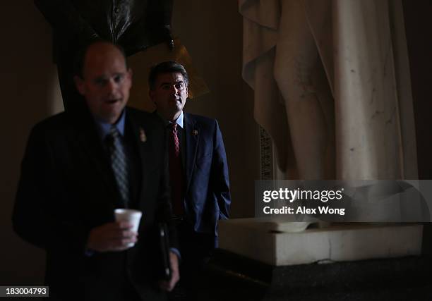 Rep. Tom Reed leaves with Rep. Cory Gardner after Reed was interviewed by a TV reporter October 3, 2013 on Capitol Hill in Washington, DC. The House...