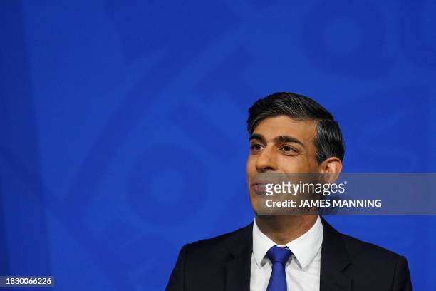 Britain's Prime Minister Rishi Sunak hosts a press conference inside the Downing Street Briefing Room, in central London, on December 7 after Britain...