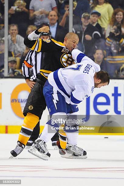 Jarome Iginla of the Boston Bruins fights against Radko Gudas of the Tampa Bay Lightning at the TD Garden on October 3, 2013 in Boston, Massachusetts.