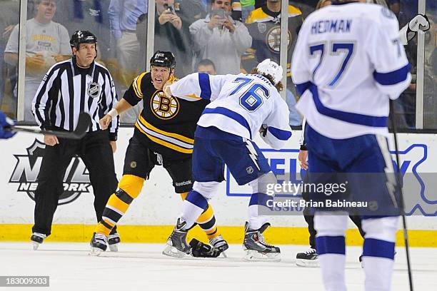 Shawn Thornton of the Boston Bruins squares up to fight against Pierre-Cedric Labrie of the Tampa Bay Lightning at the TD Garden on October 3, 2013...