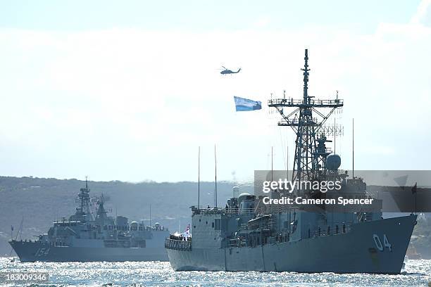 Royal Australian Navy warships HMAS Darwin and HMAS Parramatta enter Sydney Harbour on October 4, 2013 in Sydney, Australia. Over 50 ships will...