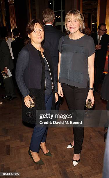 Alexandra Shulman and guest attend the launch of Geordie Greig's new book "Breakfast With Lucian" on October 3, 2013 in London, England.