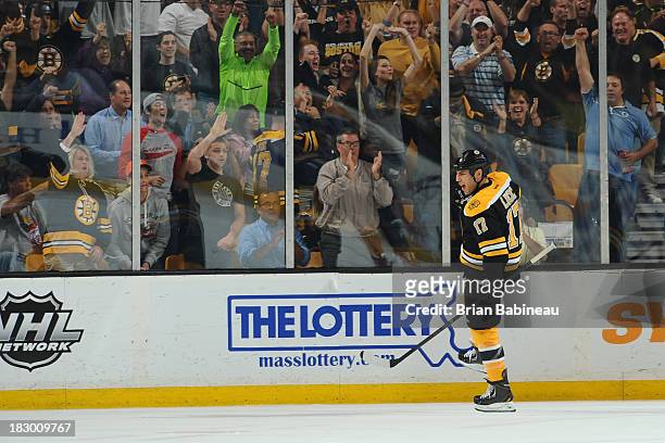 Milan Lucic of the Boston Bruins celebrates a goal against the Tampa Bay Lightning at the TD Garden on October 3, 2013 in Boston, Massachusetts.