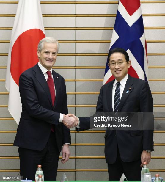Japanese Prime Minister Fumio Kishida shakes hands with his Norwegian counterpart Jonas Gahr Store before their talks in Tokyo on Dec. 7, 2023.