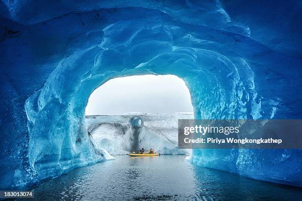 Blue ice cave inside Valdez Glacier, Alaska. People can access this glacier by kayaking