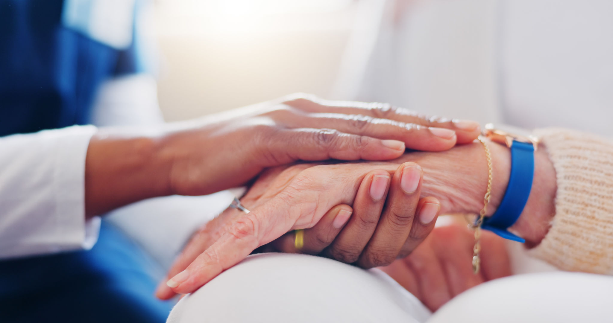 Senior patient, holding hands or consulting a nurse for support or empathy for healthcare help. Closeup, psychology or elderly person in counselling with calm caregiver in nursing home for therapy Senior patient, holding hands or consulting a nurse for support or empathy for healthcare help. Closeup, psychology or elderly person in counselling with calm caregiver in nursing home for therapy
