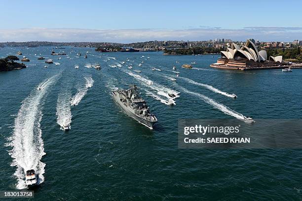 Royal Australian Navy warship HMAS Paramatta sails in front of the iconic Sydney Opera House on October 4, 2013 as part of celebrations to...