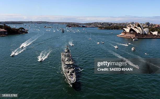 Royal Australian Navy warship HMAS Paramatta sails in front of the iconic Sydney Opera House on October 4, 2013 as part of celebrations to...