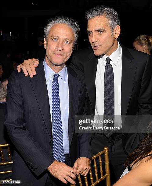 Jon Stewart and George Clooney attend the USC Shoah Foundation Institute 2013 Ambassadors for Humanity gala at the American Museum of Natural History...