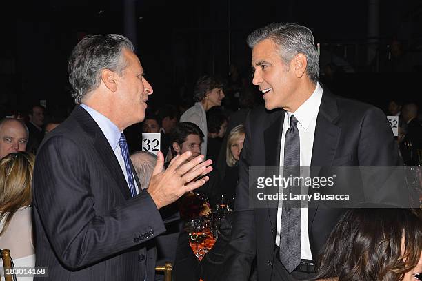 Jon Stewart and George Clooney speak at the USC Shoah Foundation Institute 2013 Ambassadors for Humanity gala at the American Museum of Natural...