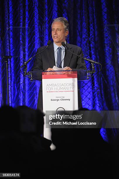 Jon Stewart speaks onstage at the USC Shoah Foundation Institute 2013 Ambassadors for Humanity gala at the American Museum of Natural History on...