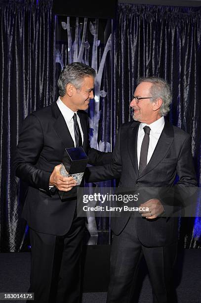 Director Steven Spielberg presents honoree George Clooney with the USC Shoah Foundations Ambassador for Humanity Award at the USC Shoah Foundation...