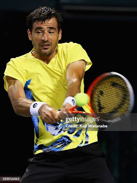 Ivan Dodig of Croatia in action during men's quarter final singles match against Jarkko Nieminen of Finland during day five of the Rakuten Open at...