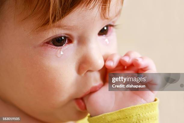 crying baby - conjunctivitis stock pictures, royalty-free photos & images