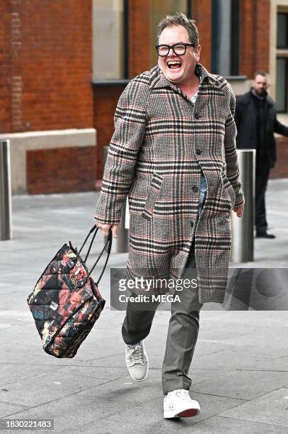Alan Carr is seen leaving Global Studios on December 7, 2023 in London, United Kingdom.