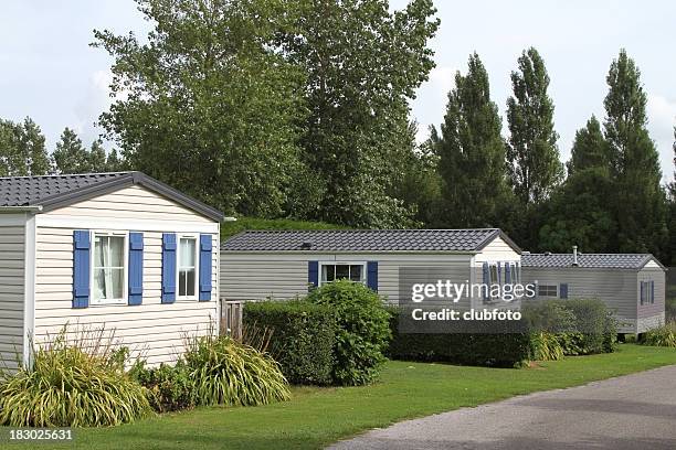 vacation static holiday caravans in a country woodland setting - manufactured housing stock pictures, royalty-free photos & images