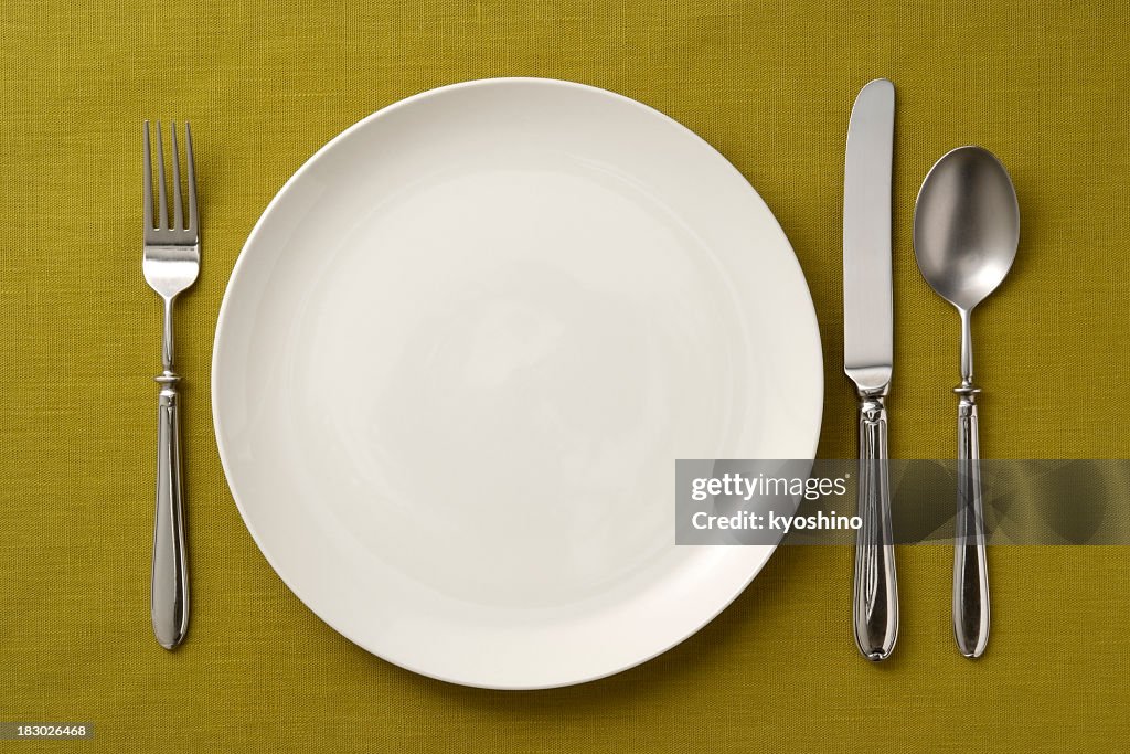 Place setting on green tablecloth