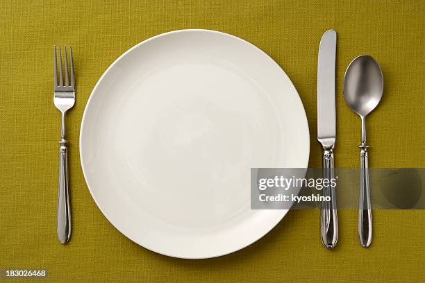 place setting on green tablecloth - empty plate setting stock pictures, royalty-free photos & images