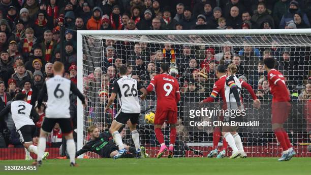 Kenny Tete of Fulham scores the team's second goal during the Premier League match between Liverpool FC and Fulham FC at Anfield on December 03, 2023...