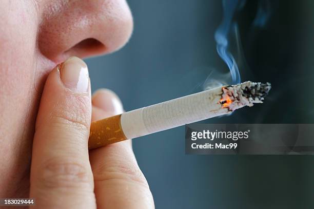 smoking cigarette - smoking issues stock pictures, royalty-free photos & images