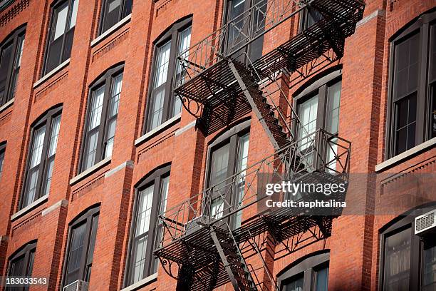 fire stairs in brick building - east village stock pictures, royalty-free photos & images