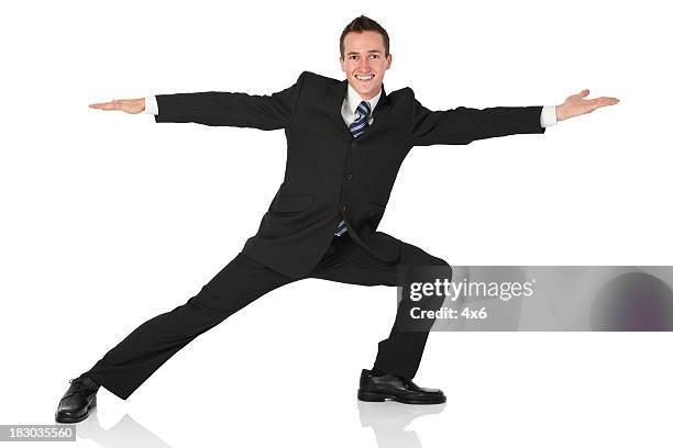 businessman doing stretching exercise - mens black dress shoes stock pictures, royalty-free photos & images