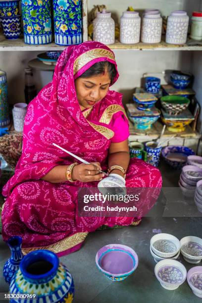 woman painting jaipur's blue pottery, rajasthan, india - pottery stock pictures, royalty-free photos & images