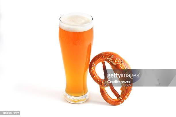 beer fest objects like glass of wheat beer and pretzel - witbier stockfoto's en -beelden