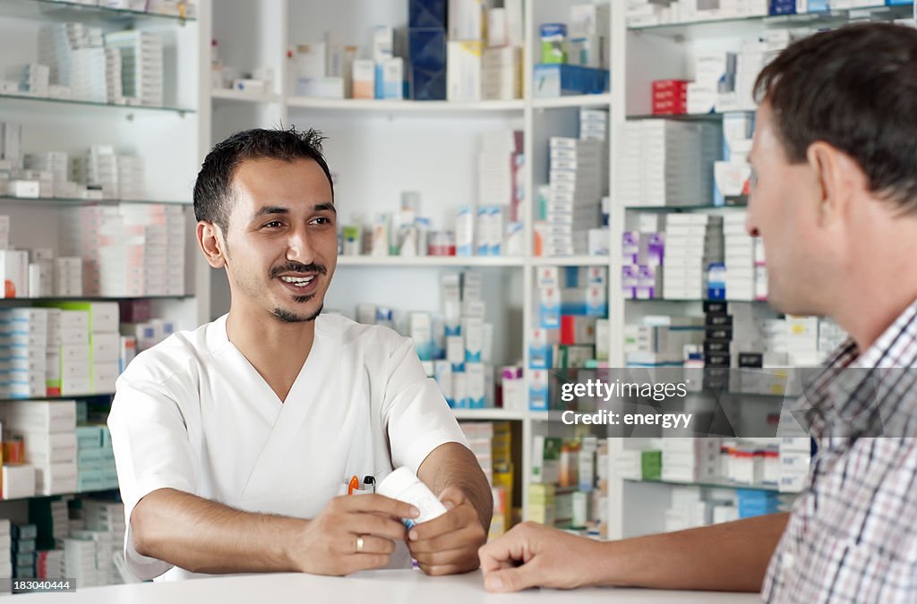 Man talking with pharmacist