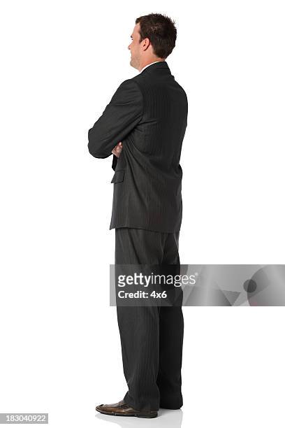 businessman standing with his arms crossed - buisnessman studio clipping path bildbanksfoton och bilder