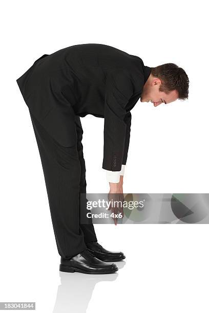 businessman exercising - touching toes stock pictures, royalty-free photos & images