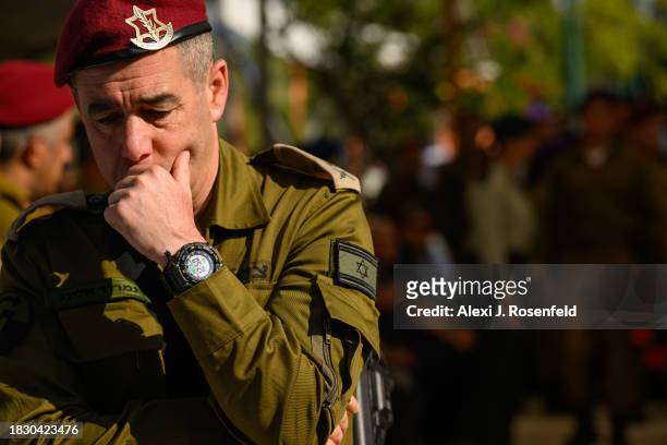 Maj. Gen Nimrod Aloni grieves for Col. Asaf Hamami, commander of Gaza Division's Southern Brigade, during his funeral at the Kiryat Shaul cemetery on...