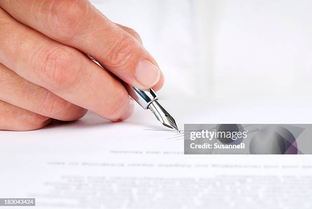 signing a contract - fountain pen stock pictures, royalty-free photos & images