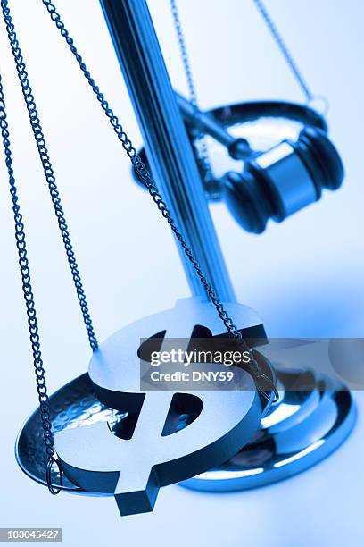 dollar sign and gavel on justice scale - legal problems stock pictures, royalty-free photos & images