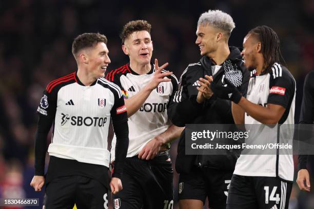 Fulham players Harry Wilson, Tom Cairney, Antonee Robinson and Bobby De Cordova-Reid celebrate victory during the Premier League match between Fulham...