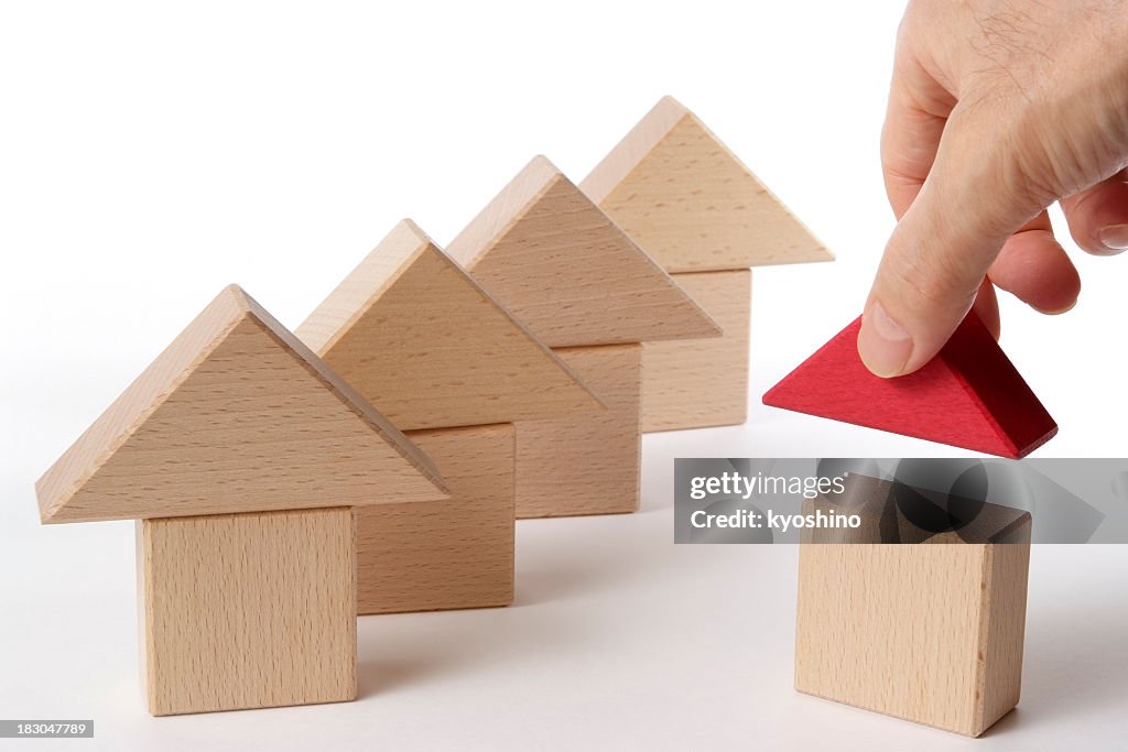 Houses of wood block made by hand on white background