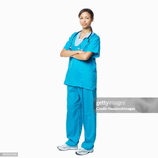 professionista medico donna in scrub-isolato - doctor standing foto e immagini stock