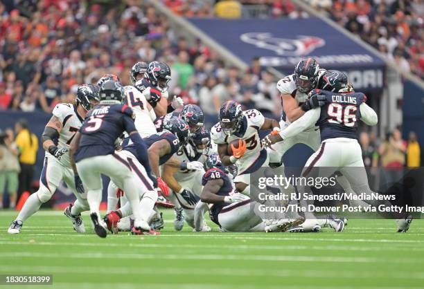 Denver Broncos running back Javonte Williams rushes the ball up field during the second half at NRG Stadium in Houston, Texas on December 3, 2023....