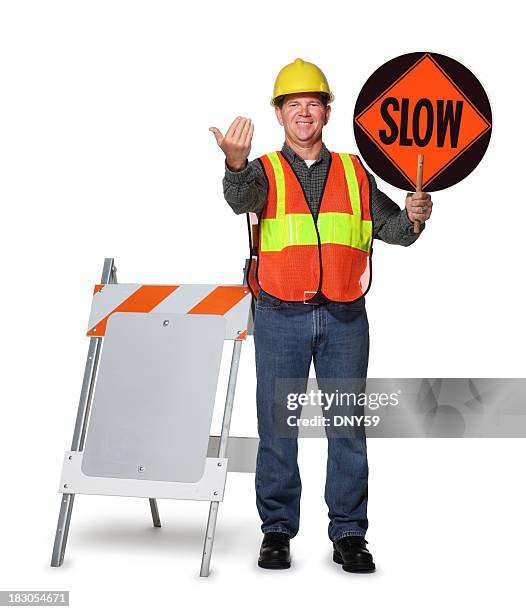 road construction worker holding slow sign on white background - verkeerspolitie stockfoto's en -beelden