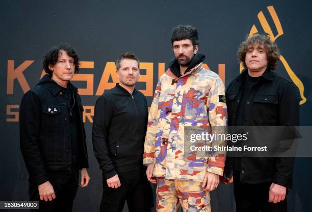 Tim Carter, Chris Edwards, Serge Pizzorno and Ian Matthews of Kasabian pose during a photocall for the announcement of Kasabian's show next summer in...