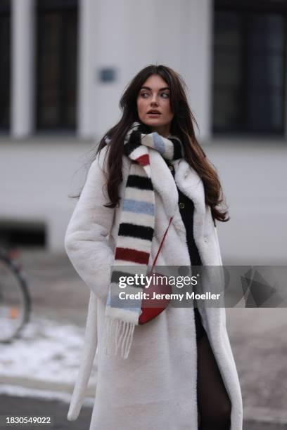 Celine Bethmann seen wearing Massimo Dutti black glitter boucle wool knit cardigan, Massimo Dutti black short skirt, Calzedonia black tights, Acne...