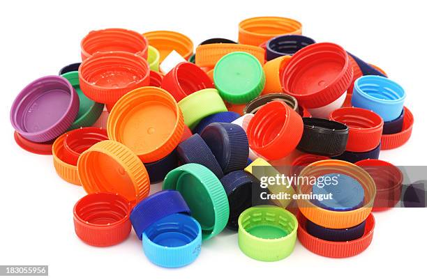 colorful plastic caps pile isolated in white - lid stock pictures, royalty-free photos & images