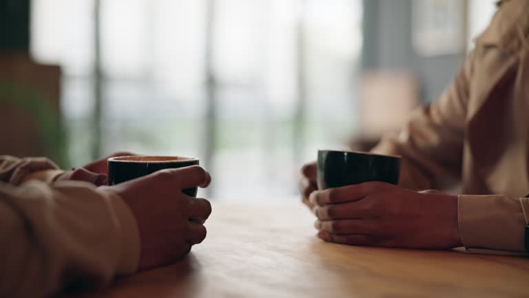 https://media.gettyimages.com/id/1830568424/video/hands-on-table-coffee-and-date-in-cafe-man-and-woman-bonding-chat-together-in-breakfast-diner.jpg?b=1&s=640x640&k=20&c=bDlnWd3CTcApiQD80nQsqI8Tr-X09bmukHKZlW5IA2k=