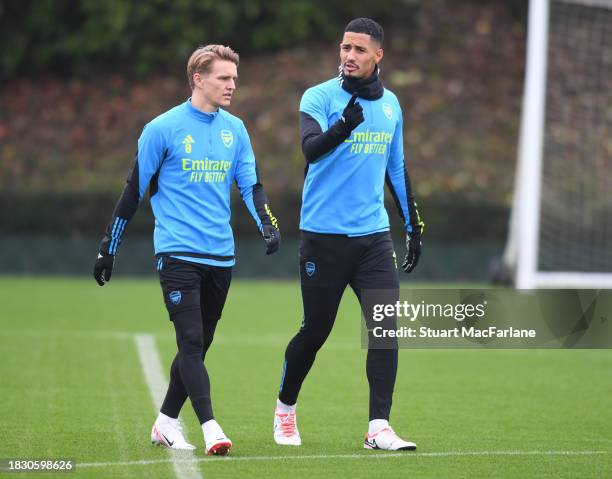 Martin Odegaard and William Saliba of Arsenal during a training session at London Colney on December 04, 2023 in St Albans, England.