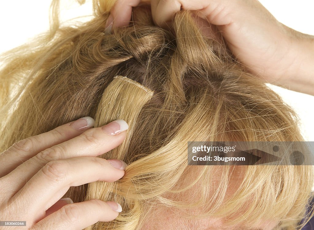 Close up of a Clip On Hair Extension Being Applied