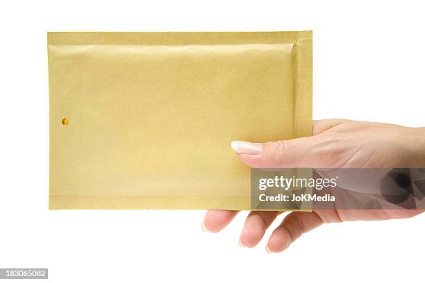 female delivering a beige envelope - sachet stockfoto's en -beelden